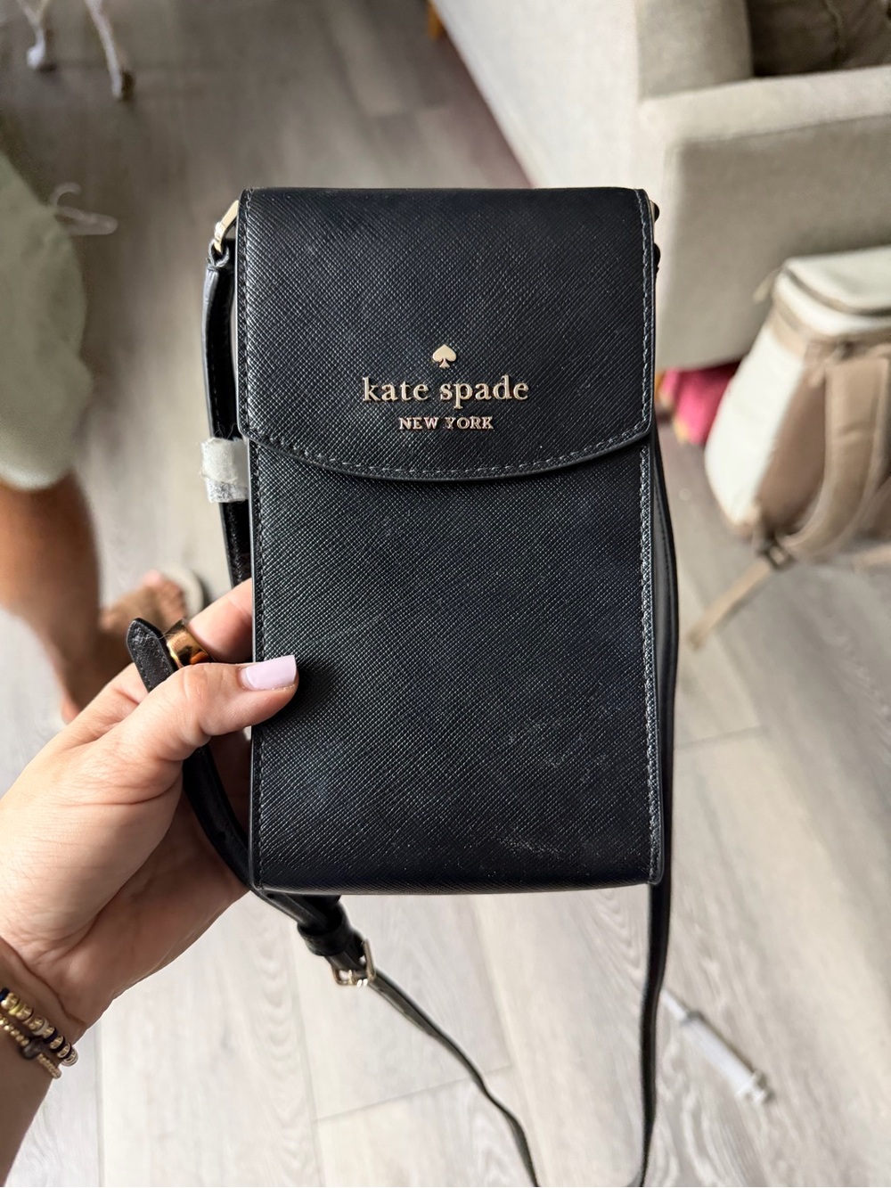 kate spade black crossbody phone bag with gold logo